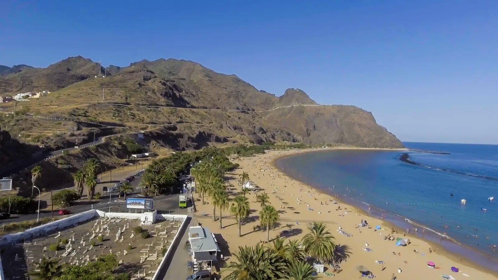 Aerial view of Las Teresitas beach and its palm trees beneath the Anaga mountains, Tenerife
